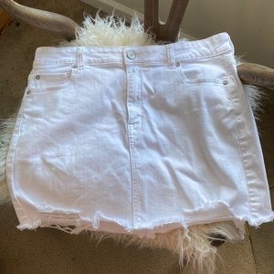 White lightly distressed denim skirt.  AmSize 16.